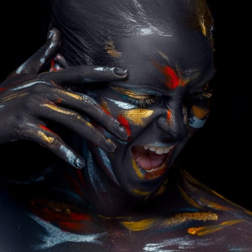 portrait-young-woman-who-is-posing-covered-with-black-paint.jpg